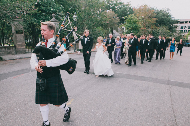 Bagpiper leading bride and groom