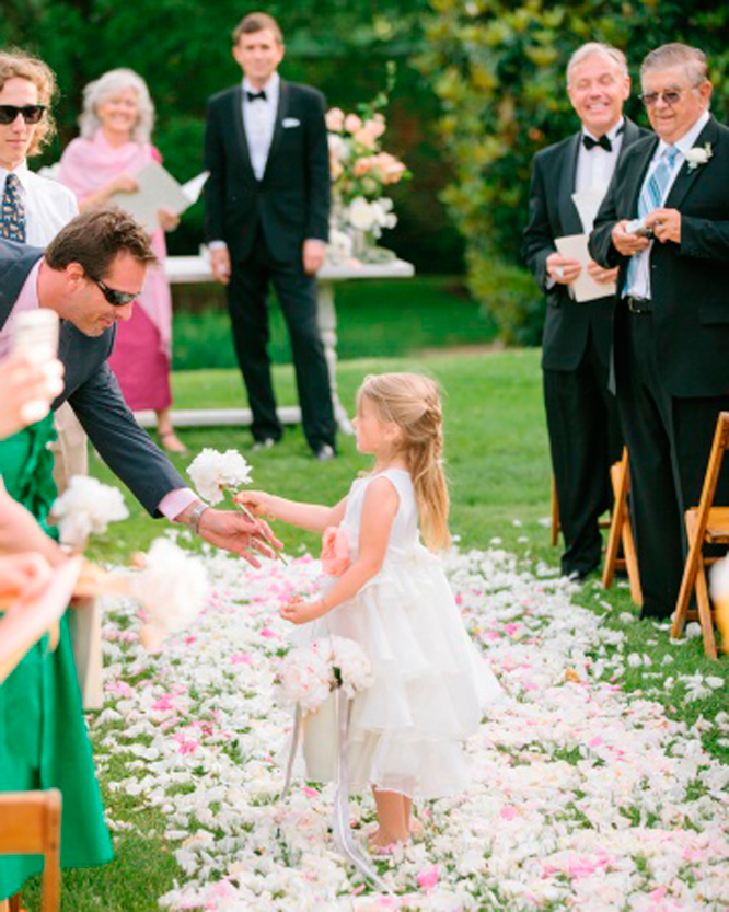 Flower girls hand out flowers